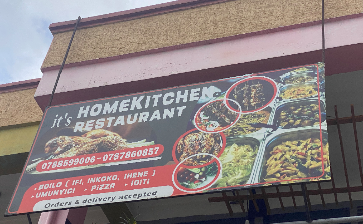Sign post for Home Kitchen Restaurant in Musanze, Rwanda, showing its name and location.