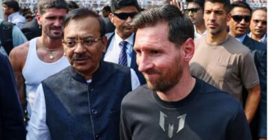 West Bengal Sports Minister Aroop Biswas shakes hands with Lionel Messi, while teammates Luis Suarez and Rodrigo De Paul stand beside them on the Salt Lake Stadium pitch in Kolkata, India.